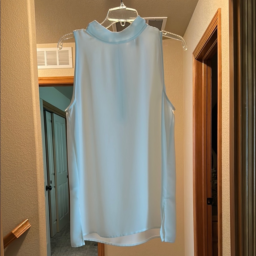 The Loft-Sleeveless Cream Blouse with zipper up the back
